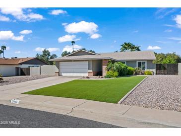 Charming single-story home with a well-manicured lawn and mature landscaping, offering great curb appeal at 15430 N 51St Pl, Scottsdale, AZ 85254