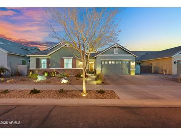 Charming home with a well-manicured front yard and inviting exterior lighting at 2617 S Jeffry St, Gilbert, AZ 85295