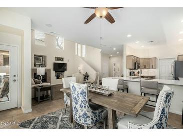 Open-concept dining area flows seamlessly into the kitchen, creating an inviting space for meals and gatherings at 7445 E Eagle Crest Dr # 1122, Mesa, AZ 85207