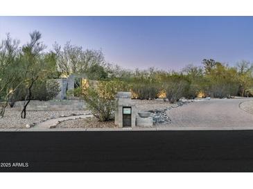 Well-manicured front entrance with desert landscaping, stone walkway, and clearly displayed house number at 8644 E Sweetwater Ave, Scottsdale, AZ 85260