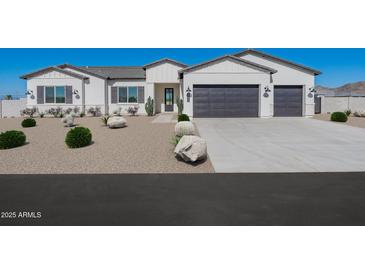 Charming single-story home featuring a well-manicured yard and a spacious two-car garage in a Gathering-friendly neighborhood at 10947 W Woodruff Rd, Casa Grande, AZ 85194