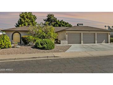 Charming single-story home featuring a two-car garage and low-maintenance desert landscaping at 1508 W Kiowa Ave, Mesa, AZ 85202