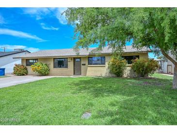 Charming single-story home with well-maintained lawn and mature landscaping at 352 E Beatryce St, Tempe, AZ 85288