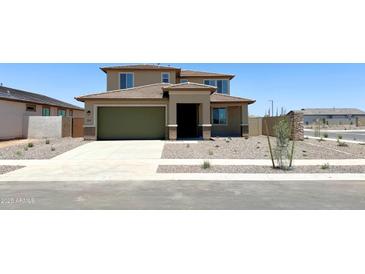 Charming two-story home with a green garage door, neutral tones, and tidy xeriscaped front yard at 15146 W Gray Fox Trl, Surprise, AZ 85387