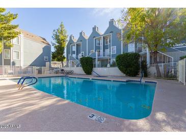 Inviting pool area with a 'No Diving' section, accompanied by nearby seating and attractive community buildings at 1505 N Center St # 220, Mesa, AZ 85201
