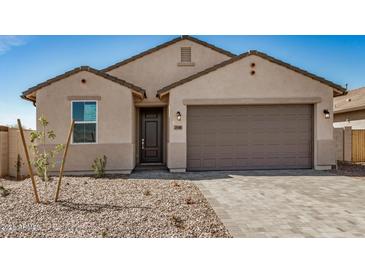 Charming single-story home with a two-car garage, desert landscaping, and a welcoming front entrance at 25308 N 133Rd Ave, Peoria, AZ 85383