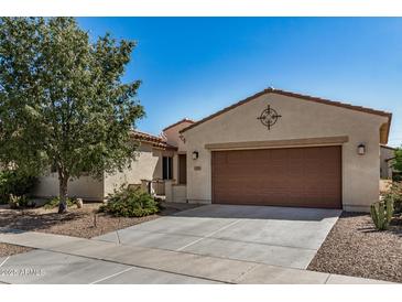 Charming single-story home featuring a spacious driveway, low-maintenance landscaping, and a welcoming facade at 240 N Monterey Ct, Casa Grande, AZ 85194