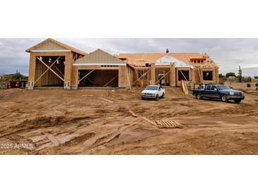 New construction: a large, single-Gathering home, framed and with a two-car garage, is being built on a vast lot in Arizona at 28668 N 151St Ave, Surprise, AZ 85387