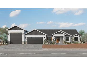 Charming single-story home with a three-car garage, desert landscaping, and modern architectural details at 28668 N 151St Ave, Surprise, AZ 85387