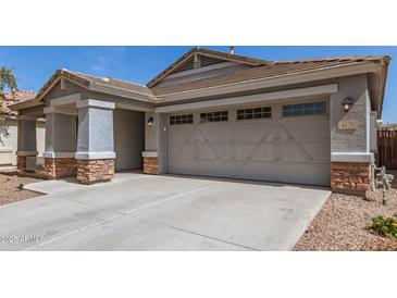 View of a large two-car garage with decorative windows above the doors at 4176 E Bonanza Rd, Gilbert, AZ 85297
