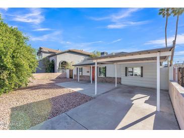 Charming single-story home featuring a covered carport and a well-maintained front yard at 4617 N 8Th Pl, Phoenix, AZ 85014