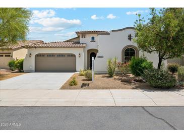 Charming single-Gathering home with a well-manicured lawn and a two-car garage in a suburban neighborhood at 18001 W Cassia Way, Goodyear, AZ 85338