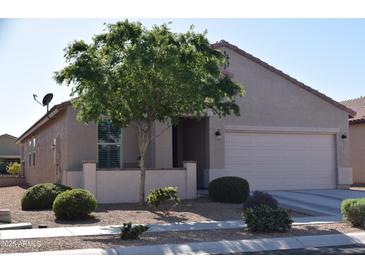 Charming single-story home with desert landscaping and a two-car garage at 429 N San Ricardo N Trl, Casa Grande, AZ 85194