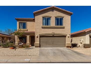 Charming two-story home with a two-car garage, covered entry, and desert landscaping at 1472 E Avenida Kino --, Casa Grande, AZ 85122