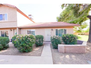 Charming single-story home featuring desert landscaping and a welcoming walkway leading to the front door at 17620 N 17Th Pl # 36, Phoenix, AZ 85022