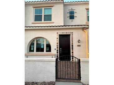 Charming front of home with arched window and tiled doorway at 4077 S Sabrina Dr # 94, Chandler, AZ 85248