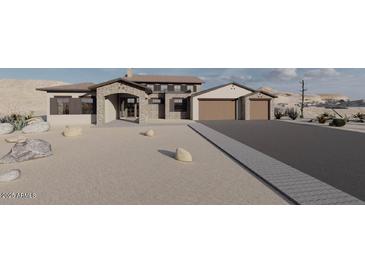 Stunning desert home boasts stone accents, two-car garage and impeccable drought resistant landscaping at 12053 W Palo Brea Ln, Peoria, AZ 85383
