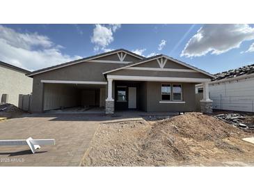 Charming single-Gathering home featuring a welcoming porch and an attached garage at 15777 W Cheryl Dr, Waddell, AZ 85355