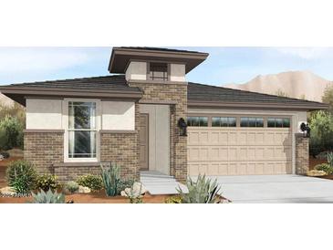 Charming single-story home with brick accents, desert landscaping, and a two-car garage at 19405 W Badgett Ln, Litchfield Park, AZ 85340