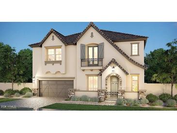 Charming two-story home boasts a well-manicured lawn, stone accents and neutral colors at 2541 E Presidio St, Mesa, AZ 85213