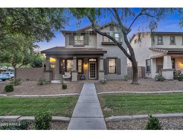 Charming two-story home featuring a cozy front porch and well-maintained landscaping at 3678 E Yeager Ct, Gilbert, AZ 85295