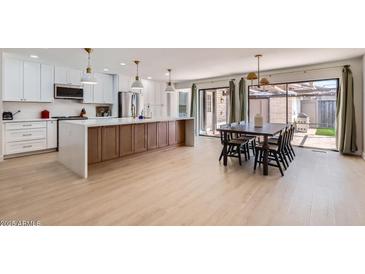 Modern kitchen with sleek countertops, stainless steel appliances, and an island at 1550 N Stapley Dr # 21, Mesa, AZ 85203