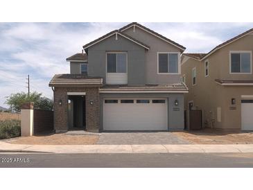 Charming two-story home with a two-car garage and well-maintained landscaping at 1571 E Tiffany Way, Gilbert, AZ 85298