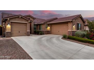 Stunning exterior with a spacious driveway and well-maintained landscaping at 18368 W Long Lake Rd, Goodyear, AZ 85338