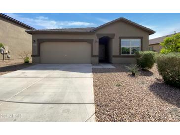 Charming single-story home featuring a two-car garage and low-maintenance desert landscaping at 2367 E Rosario Mission Dr, Casa Grande, AZ 85194