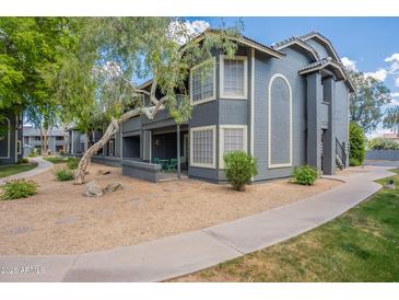 Inviting apartment featuring a charming patio and well-maintained landscape with walkway at 255 S Kyrene Rd # 212, Chandler, AZ 85226