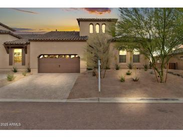 Charming single-Gathering home showcasing a desert-friendly landscaped front yard and a convenient two-car garage at 17913 W Sunward Dr, Goodyear, AZ 85338