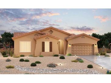 Charming single-story home featuring desert landscaping and a tile roof at 19949 W Mulberry Dr, Buckeye, AZ 85396