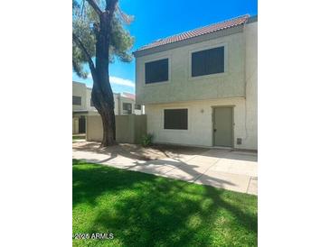 Charming two-story townhouse features a tiled roof, and an inviting entryway at 4832 W Rancho Dr, Glendale, AZ 85301