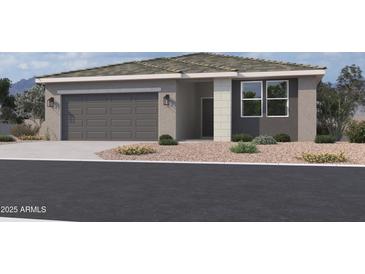 Charming single-story home with a two-car garage and desert landscaping at 5551 S 240Th Ln, Buckeye, AZ 85326