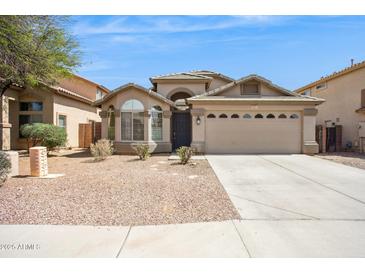 Charming single-story home with desert landscaping and a two-car garage at 11351 N 153Rd Dr, Surprise, AZ 85379