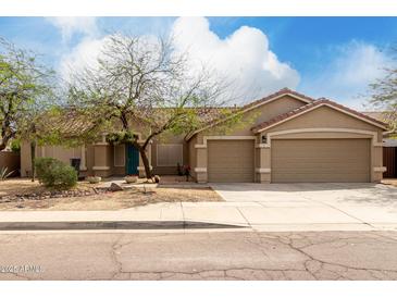 Charming single-story home featuring a two-car garage and well-maintained front yard at 1425 E Darrel Rd, Phoenix, AZ 85042