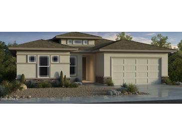 Contemporary single-story home boasting a neutral palette, desert landscaping, and a convenient two-car garage at 17837 W Pasadena Ave, Litchfield Park, AZ 85340