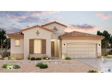 Charming single-story home featuring a tile roof, neutral stucco and desert landscaping for low maintenance appeal at 20258 W Catalina Dr, Buckeye, AZ 85396