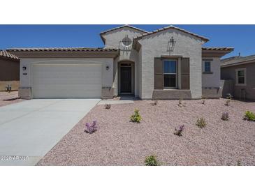 Inviting single-story home with a two car garage and low maintenance desert landscaping at 20258 W Catalina Dr, Buckeye, AZ 85396