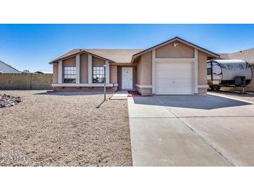 Charming single-story home with a gravel front yard and a convenient attached garage at 3339 W Mohawk Ln, Phoenix, AZ 85027