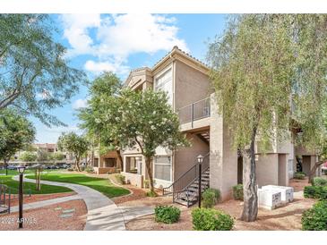 Attractive apartment building featuring well-maintained landscaping and inviting walkways at 3830 E Lakewood Pkwy # 2162, Phoenix, AZ 85048