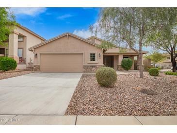 Charming single-story home with a well-maintained front yard, two car garage, and inviting curb appeal at 4433 W Phalen Dr, Phoenix, AZ 85087