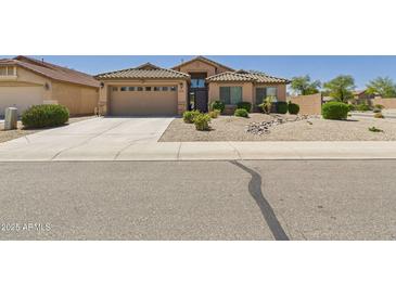 Charming single-story home featuring a two-car garage and desert landscaping for low maintenance at 28942 N Lazurite Way, San Tan Valley, AZ 85143