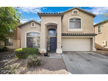Charming two-story home with landscaped yard and two car garage at 8708 S 50Th Ln, Laveen, AZ 85339