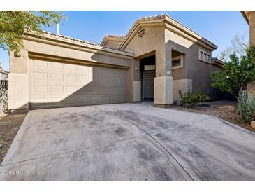 Charming single-story home with desert landscaping, a two-car garage, and a covered front entry at 4031 E Barwick Dr, Cave Creek, AZ 85331