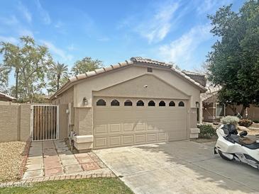 Charming single-story home featuring a two-car garage, gated entry, and well-maintained landscaping at 7915 N 53Rd Dr, Glendale, AZ 85301