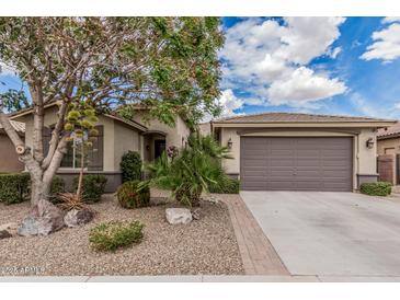 Charming single-story home features desert landscaping and a spacious two-car garage at 1078 W Redwood Ave, Queen Creek, AZ 85140