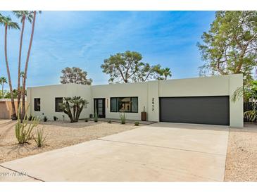 Contemporary home featuring desert landscaping, modern architecture, and a spacious driveway at 2517 E Sahuaro Dr, Phoenix, AZ 85028