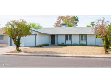Charming single-story home with a well-maintained front yard and mature landscaping at 313 E Westchester Dr, Tempe, AZ 85283
