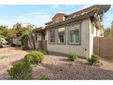 Charming home featuring well-maintained landscaping with beautiful windows and a beige exterior at 7336 S 48Th Gln, Laveen, AZ 85339